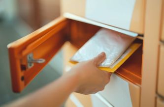 person retrieving mail from a private postal box.